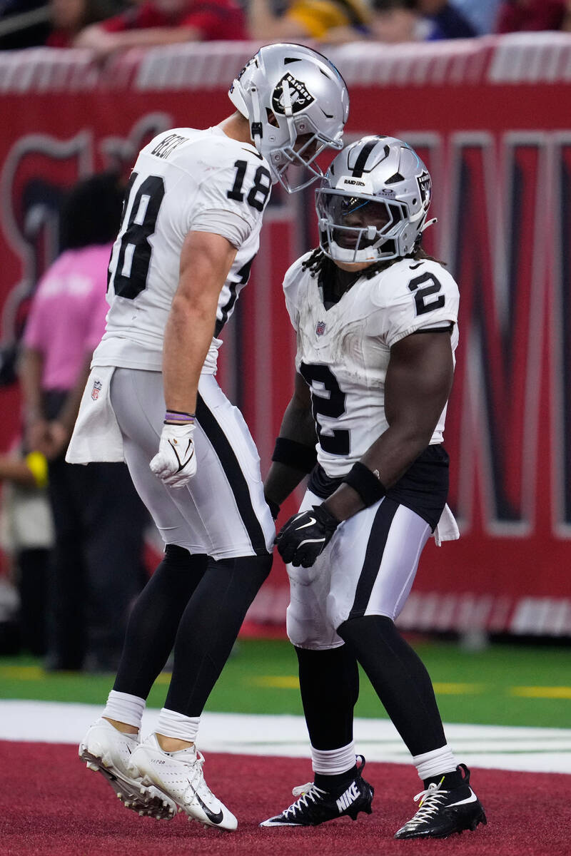 Las Vegas Raiders running back Ashton Jeanty (2) is congratulated by wide receiver Jack Bech (1 ...