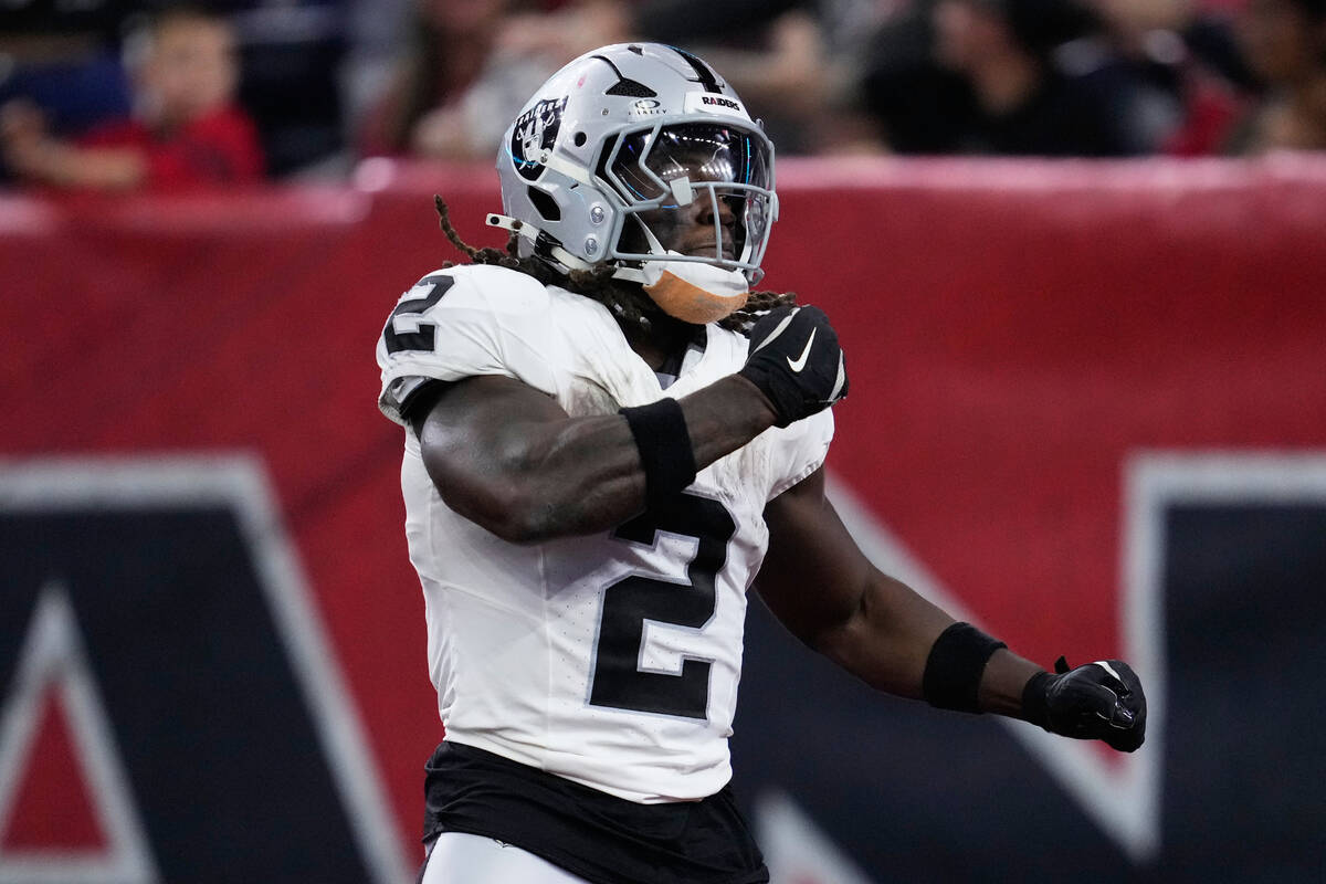 Las Vegas Raiders running back Ashton Jeanty (2) celebrates after scoring against the Houston T ...