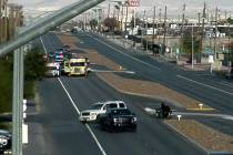 Police investigate a crash Sunday, Dec. 21, 2025, on North Las Vegas Boulevard and Walnut Road ...