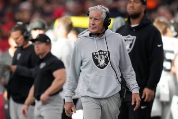 Las Vegas Raiders head coach Pete Carroll walks on the sideline during the first half of an NFL ...