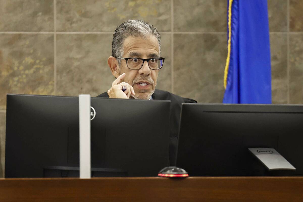 Judge Michael Villani presides over defendant Maurice Washington’s plea hearing at the R ...