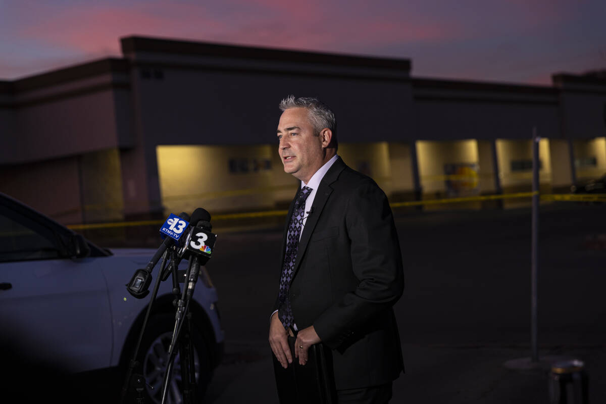 Metropolitan Police Department Lt. Robert Price speaks as officers investigate the scene where ...