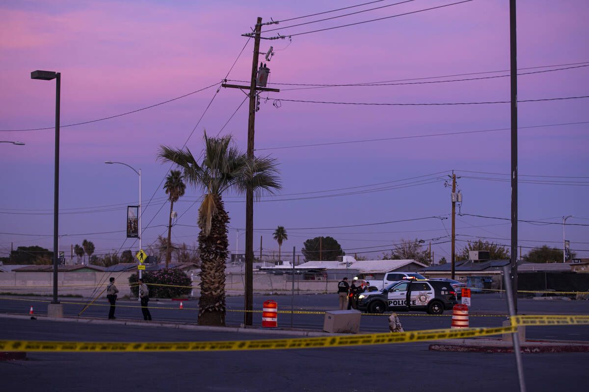 Metropolitan Police Department officers investigate the scene where a person was fatally stabbe ...