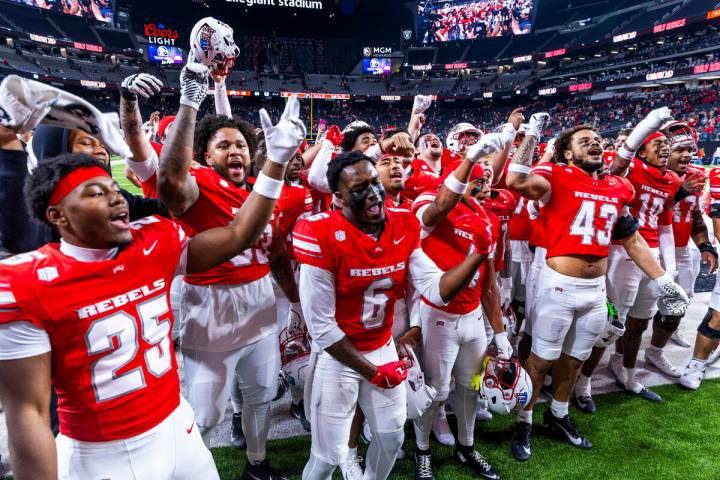 UNLV player sing the school fight song and dance in the end zone after their double overtime wi ...