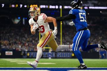 San Francisco 49ers running back Christian McCaffrey (23) runs in for a touchdown during an NFL ...