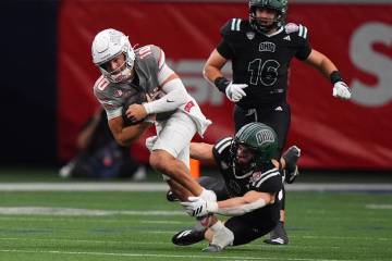 UNLV quarterback Anthony Colandrea (10) is tackled by Ohio linebacker Jack Fries (27) during th ...