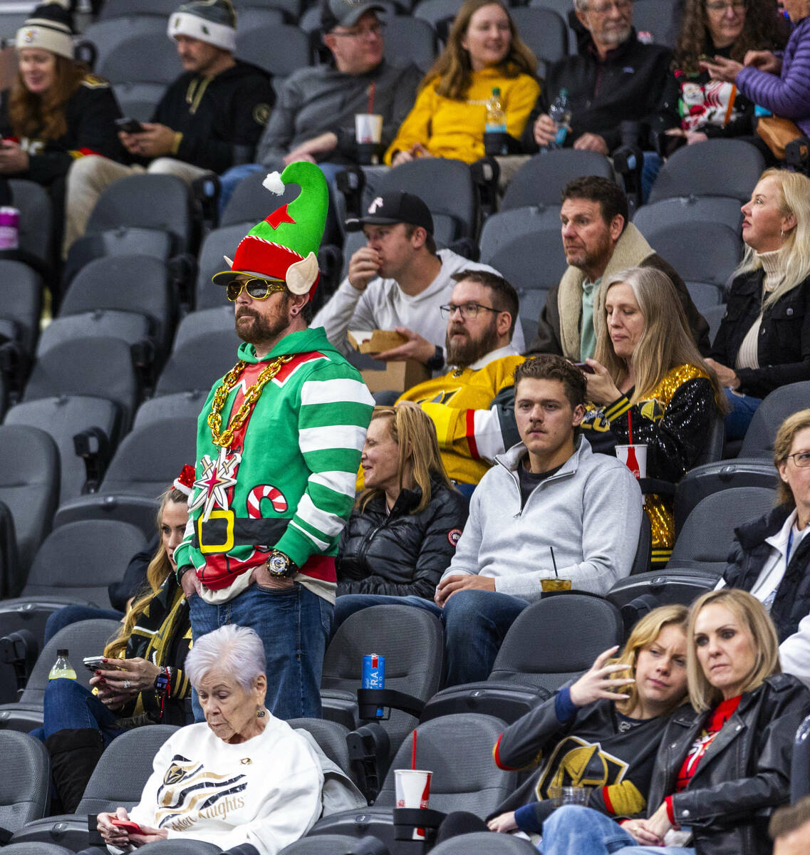 An elf joins Golden Knights fans watching the team in warm ups before facing the San Jose Shark ...
