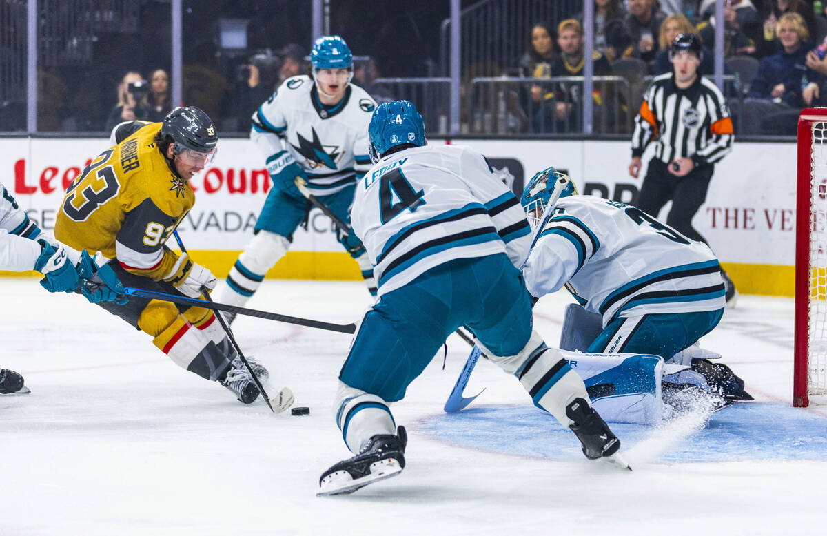 Golden Knights right wing Mitch Marner (93) sets up a score against San Jose Sharks goaltender ...