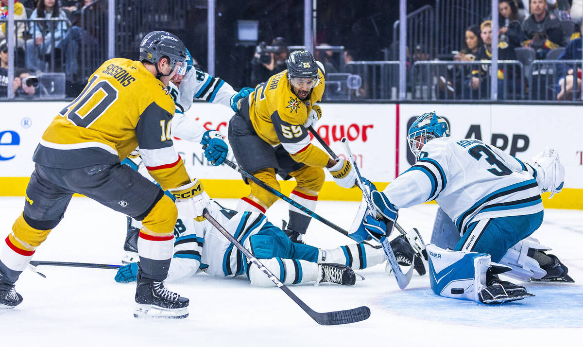 Golden Knights right wing Keegan Kolesar (55) sends a pass to center Colton Sissons (10) to sho ...