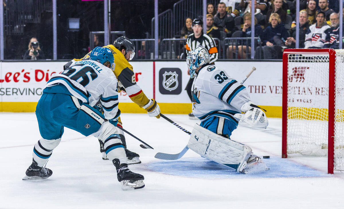 Golden Knights right wing Mark Stone (61) sneaks in a goal against San Jose Sharks goaltender Y ...