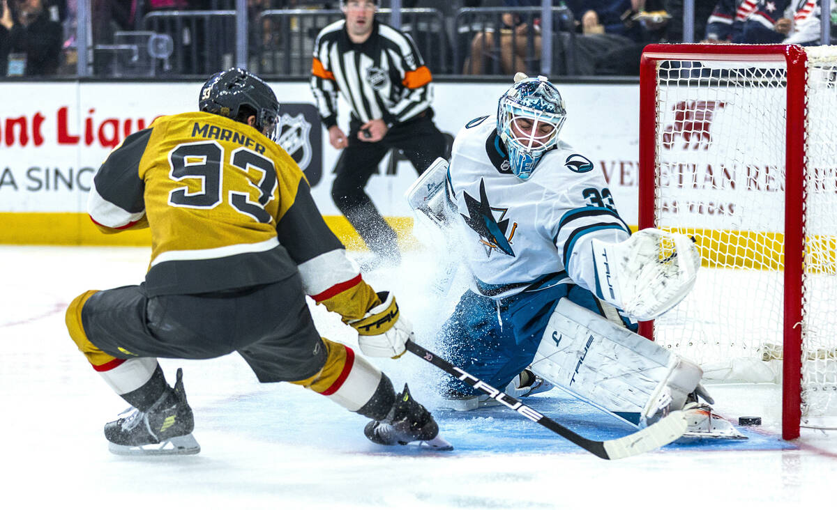 Golden Knights right wing Mitch Marner (93) scores past San Jose Sharks goaltender Alex Nedeljk ...