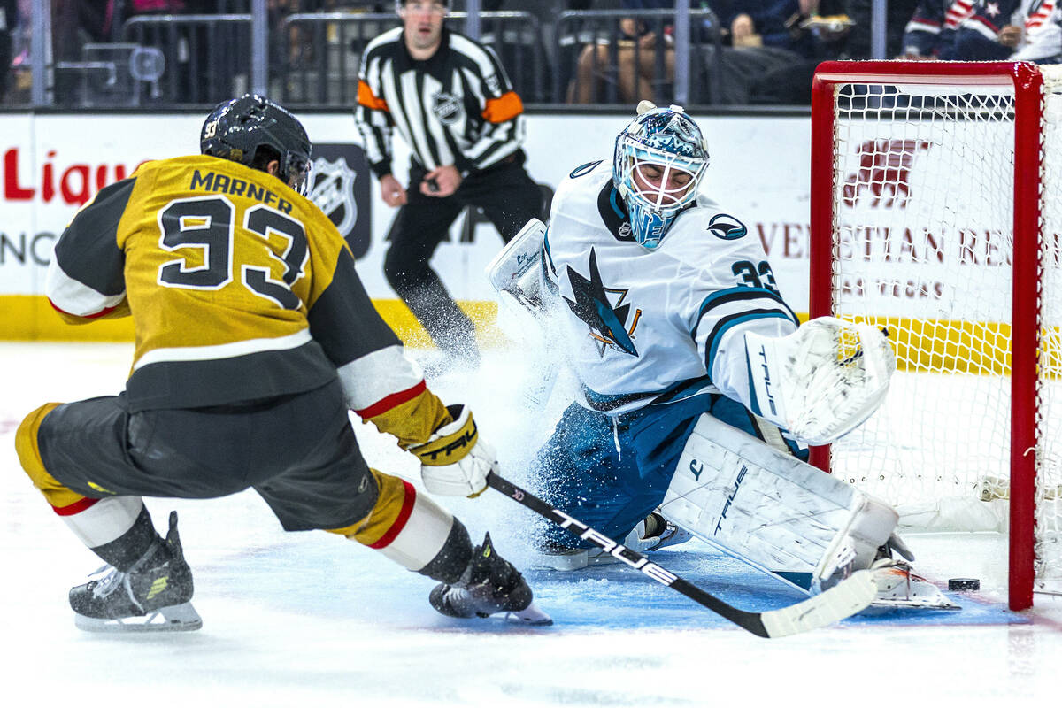 Golden Knights right wing Mitch Marner (93) scores past San Jose Sharks goaltender Alex Nedeljk ...