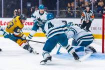 Golden Knights right wing Mitch Marner (93) sets up a score against San Jose Sharks goaltender ...