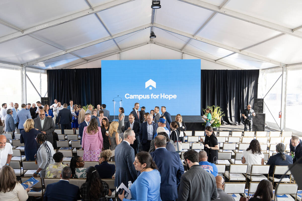 Guests mingle before the groundbreaking ceremony for the Campus for Hope site in Las Vegas July ...