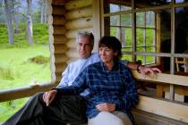 This undated photo released by the U.S. Department of Justice shows Jeffrey Epstein and Ghislai ...