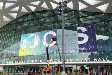 A window wrap is installed on the Las Vegas Convention Center West Hall entrance Monday, Decemb ...