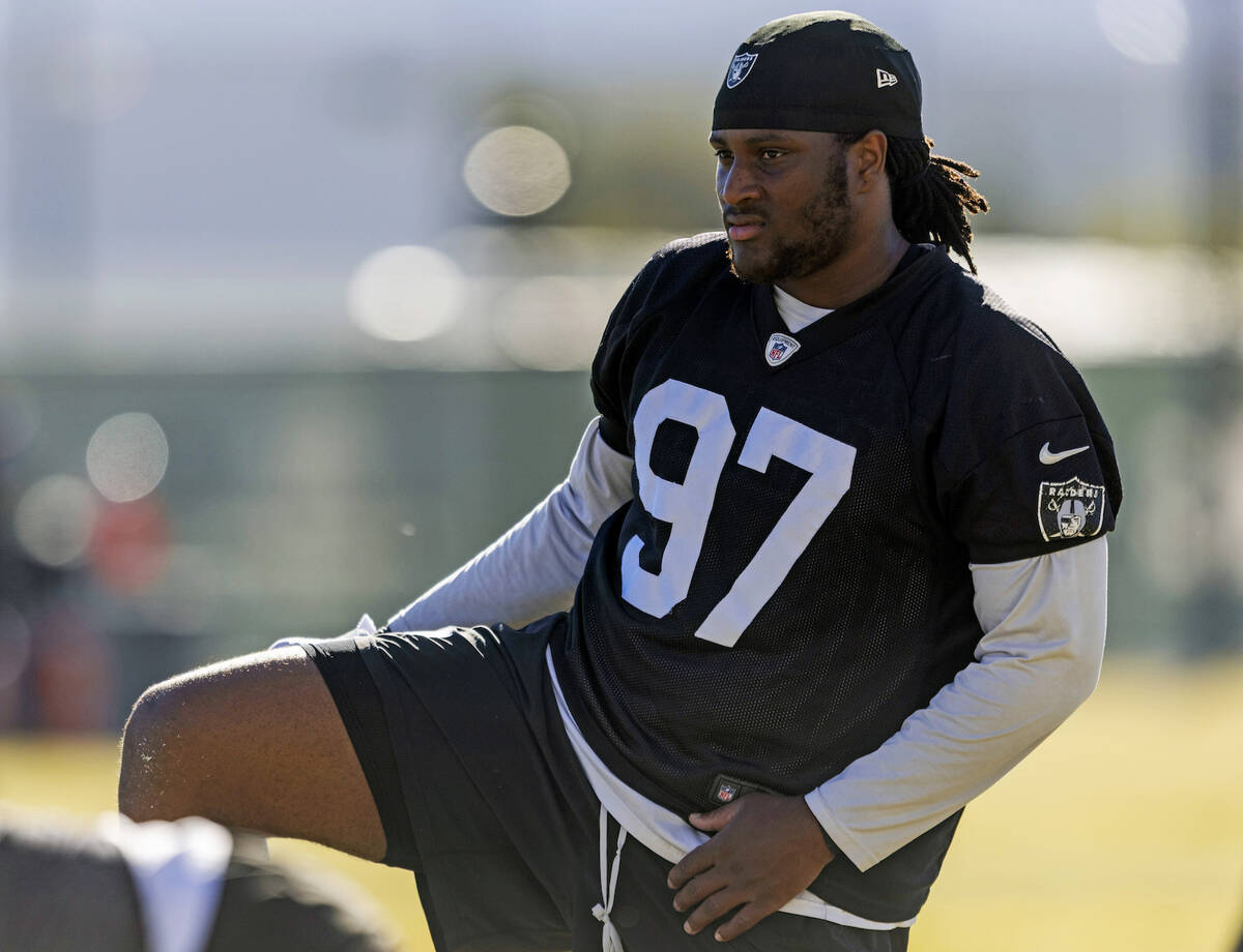 Raiders defensive tackle Tonka Hemingway (97) stretches during the team’s practice at th ...