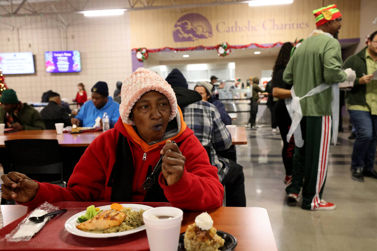 Charisse Means, 55, eats a Christmas meal at Catholic Charities of Southern Nevada in Las Vegas ...