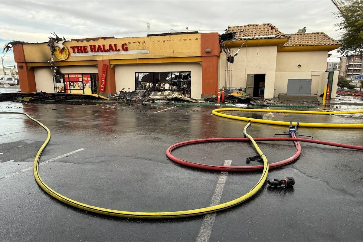 Crews investigate a structure fire early Friday morning in Las Vegas' Chinatown area on Dec. 26 ...