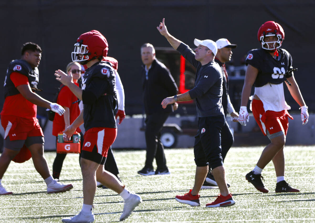 Utah's head coach Morgan Scalley instructs his players during the team’s practice at the Fert ...