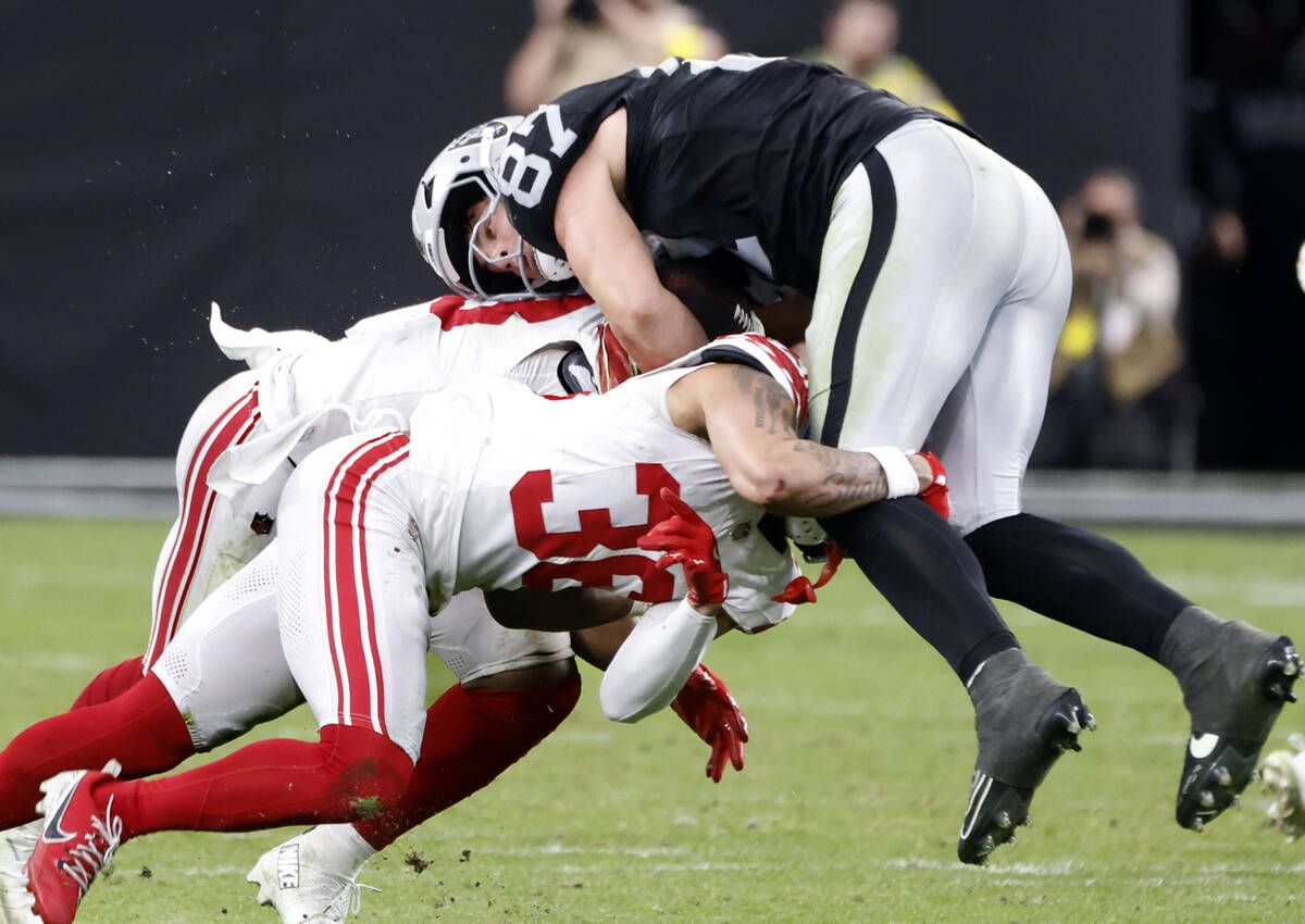 Raiders tight end Michael Mayer (87) is tackled by Giants cornerback Rico Payton (36) during th ...