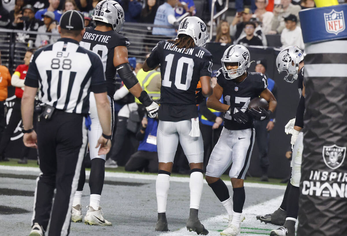 Raiders wide receiver Tyler Lockett (17) celebrates his touchdown during the second half of an ...
