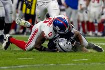 New York Giants linebacker Brian Burns sacks Raiders quarterback Geno Smith (7) during the seco ...