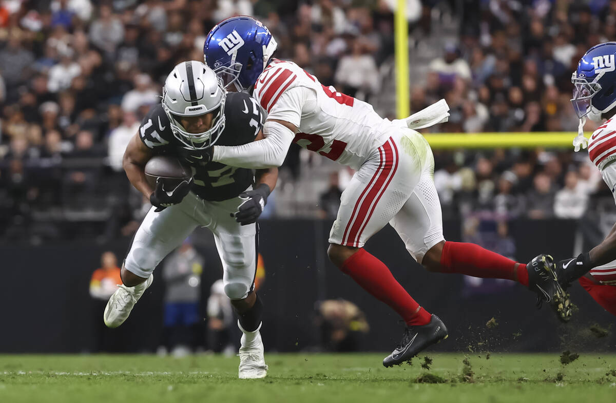 Raiders wide receiver Tyler Lockett (17) runs the ball as New York Giants cornerback Dru Philli ...