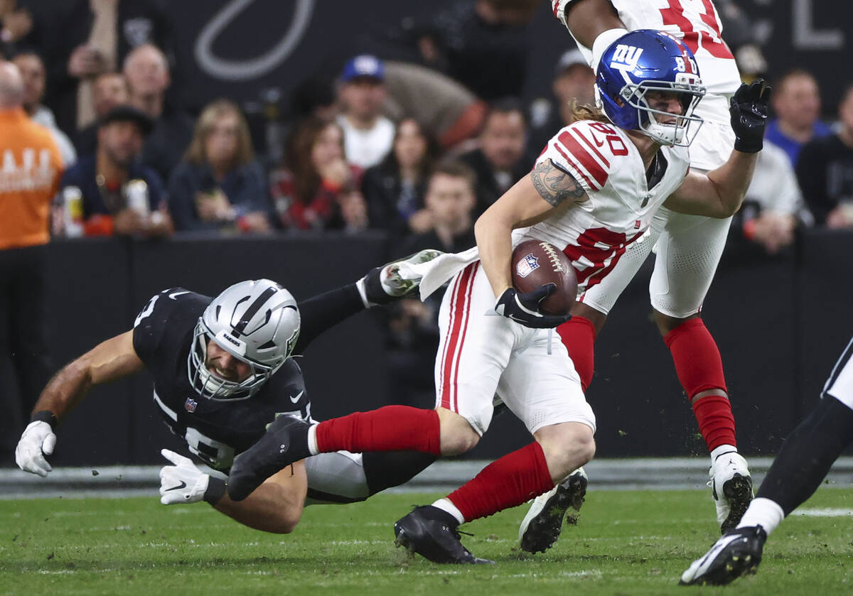 New York Giants wide receiver Gunner Olszewski (80) outruns Raiders guard Jackson Powers-Johnso ...