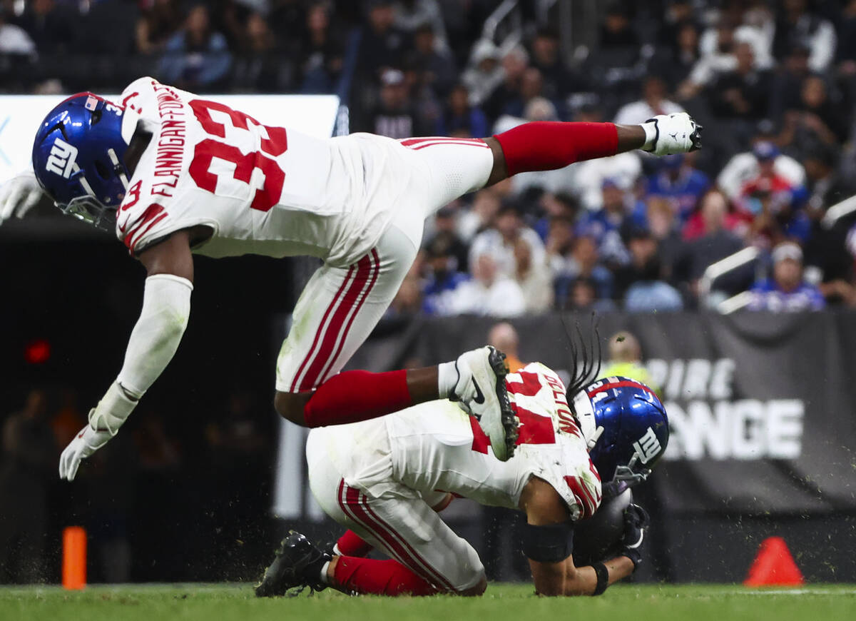 New York Giants safety Dane Belton (24) intercepts a pass from the Raiders during the second ha ...