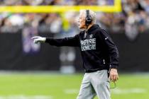 Raiders head coach Pete Carroll points to the field during the first half of an NFL game agains ...