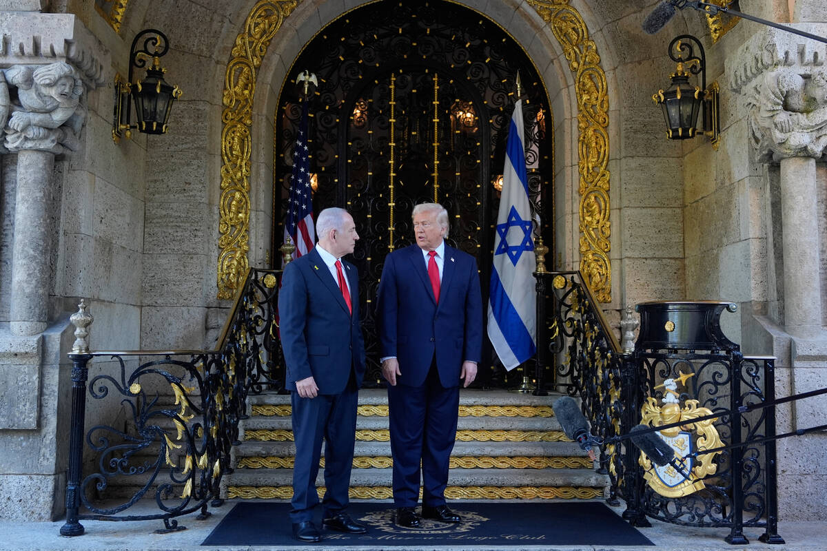 President Donald Trump greets Israel's Prime Minister Benjamin Netanyahu at his Mar-a-Lago ...