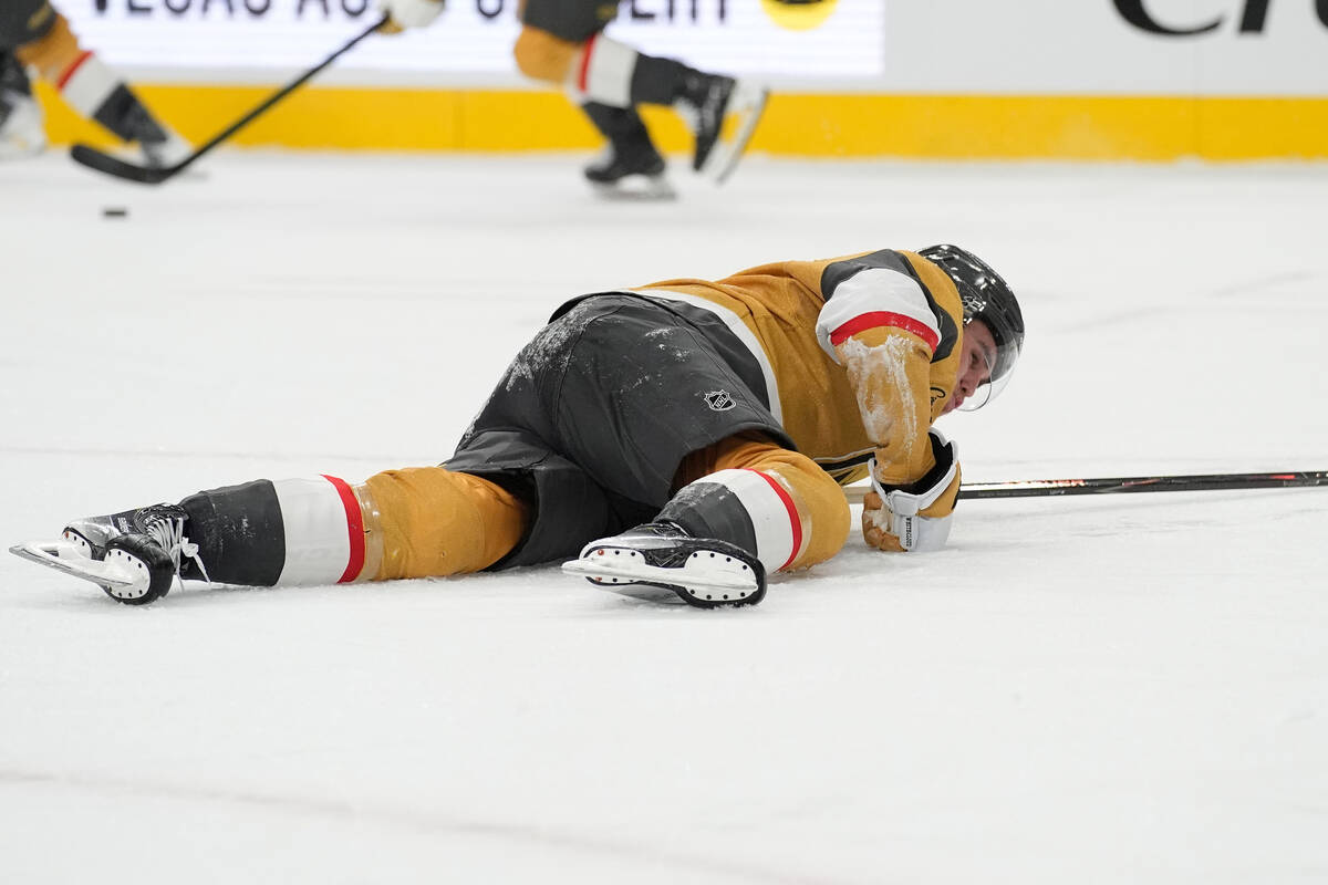 Vegas Golden Knights defenseman Zach Whitecloud (2) lies on the ice during the third period of ...