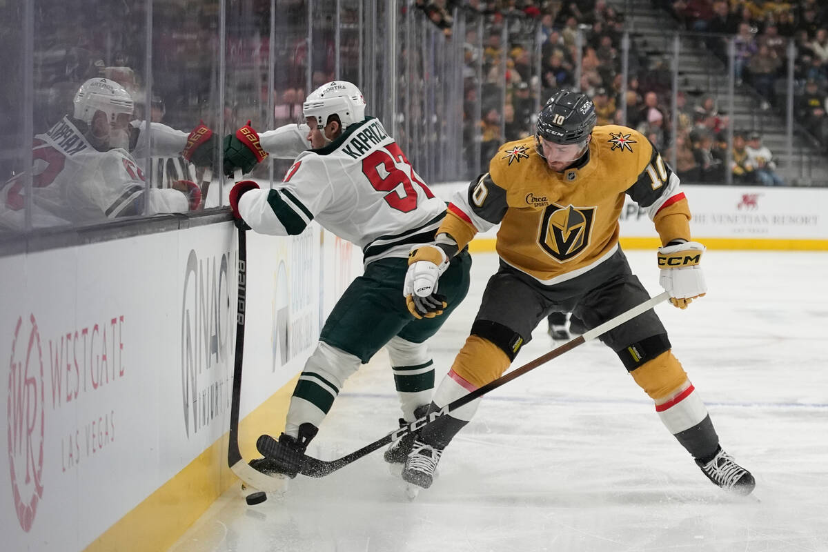 Vegas Golden Knights center Colton Sissons (10) and Minnesota Wild left wing Kirill Kaprizov (9 ...