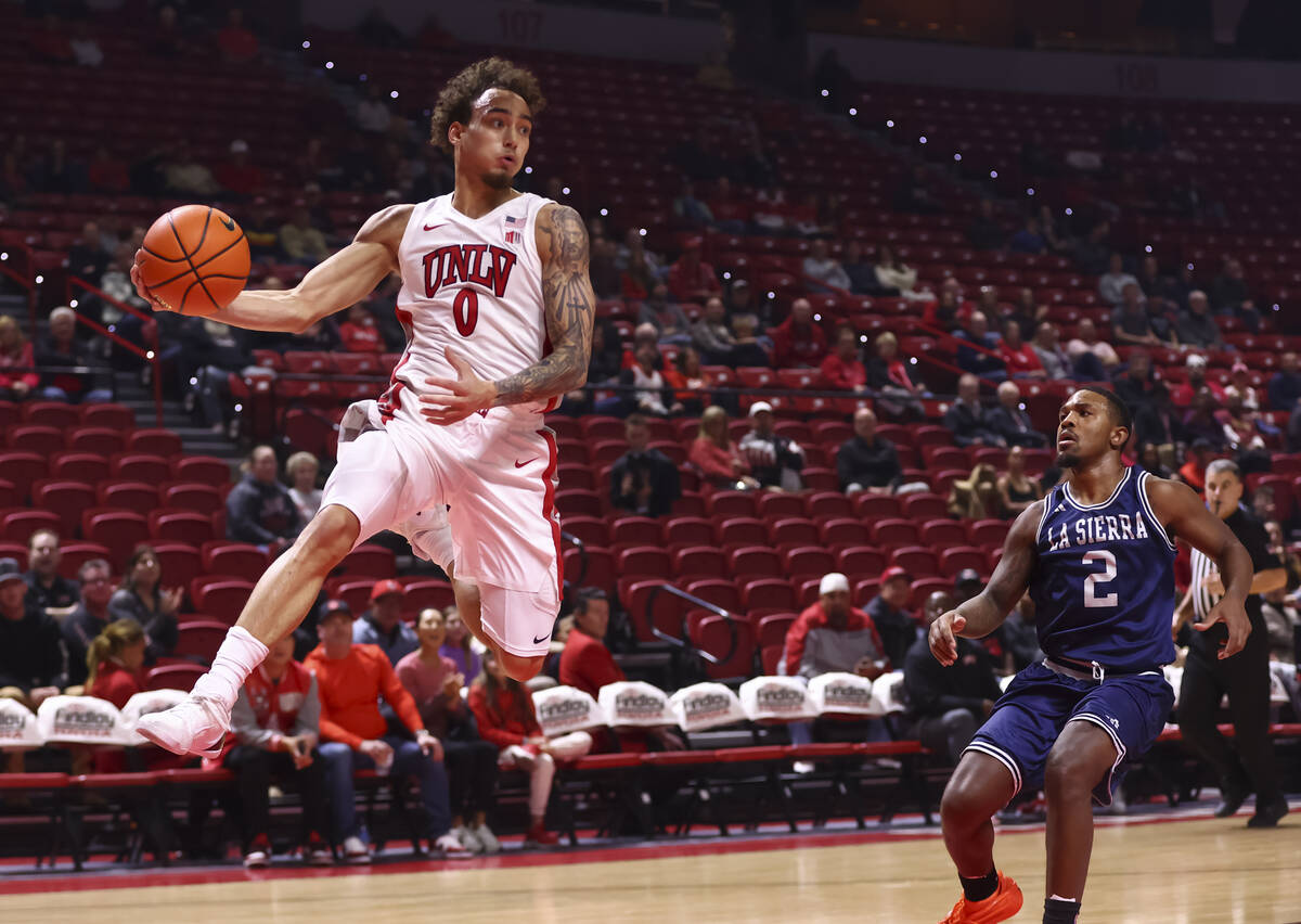 UNLV Rebels guard Dravyn Gibbs-Lawhorn (0) looks to pass the ball as La Sierra Golden Eagles gu ...