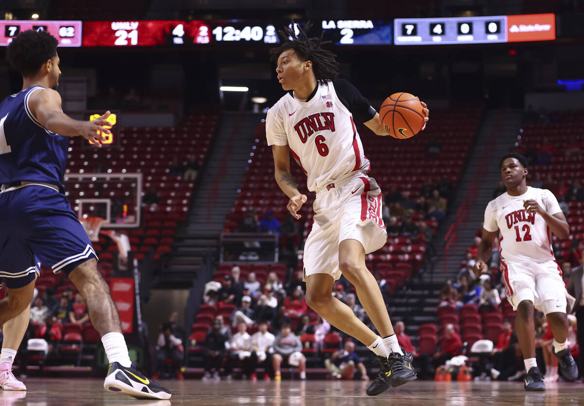 UNLV Rebels forward Tyrin Jones (6) drives the ball against the La Sierra Golden Eagles during ...