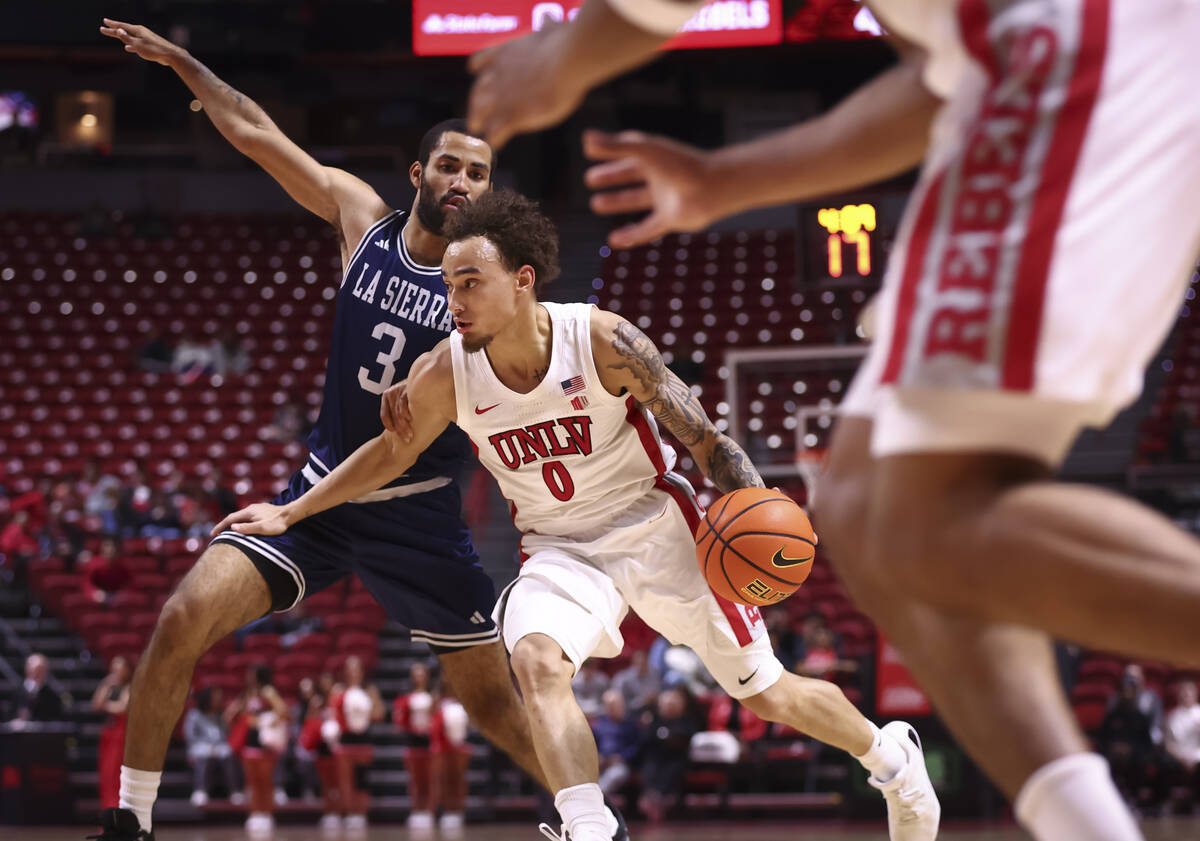 UNLV Rebels guard Dravyn Gibbs-Lawhorn (0) drives the ball against La Sierra Golden Eagles guar ...