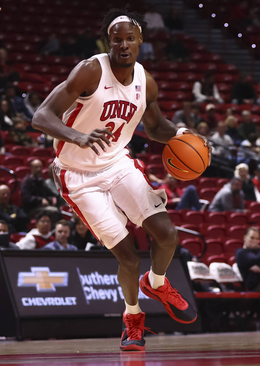 UNLV Rebels center Emmanuel Stephen (34) brings the ball up court against the La Sierra Golden ...