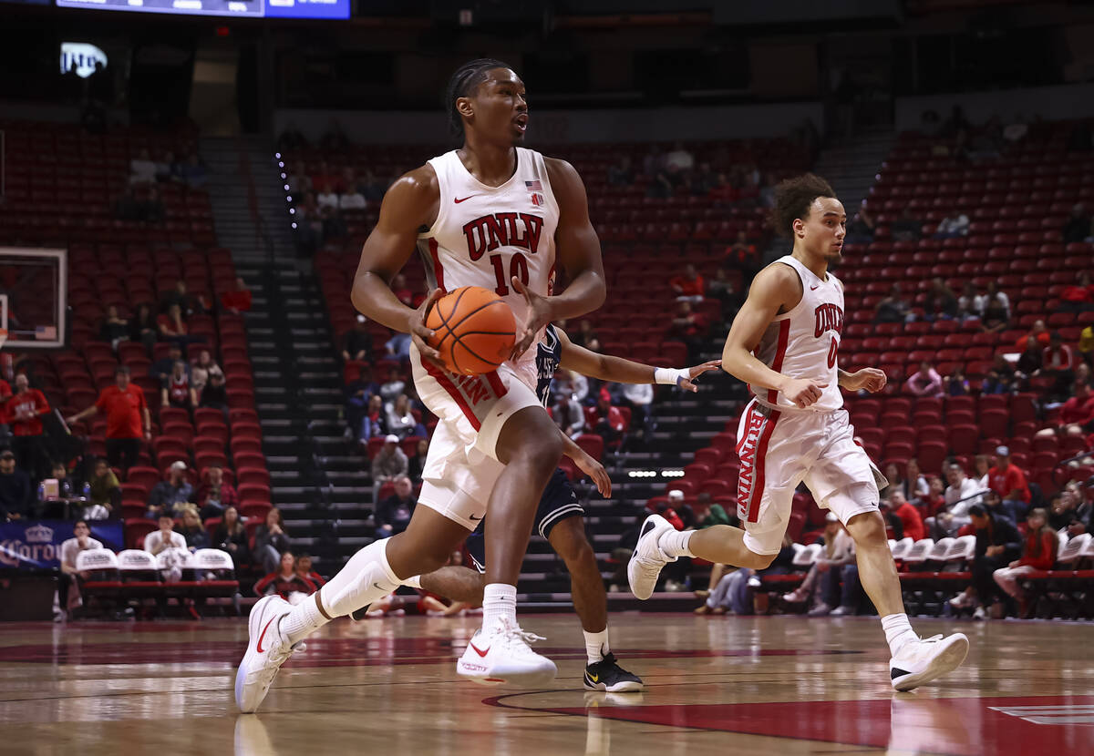 UNLV Rebels forward Jacob Bannarbie (10) brings the ball up court against the La Sierra Golden ...