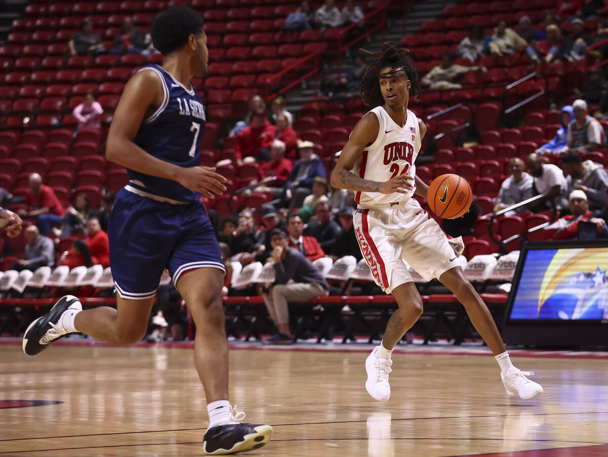 UNLV Rebels forward Naas Cunningham (24) brings the ball up court as La Sierra Golden Eagles fo ...