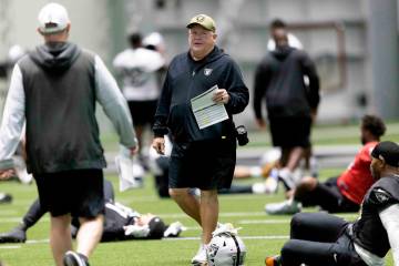 Raiders offensive coordinator Chip Kelly walks through the team’s practice at the Interm ...