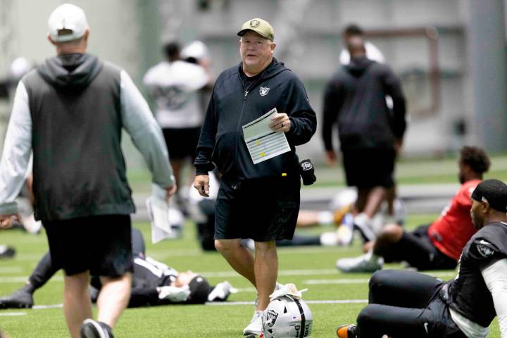Raiders offensive coordinator Chip Kelly walks through the team’s practice at the Interm ...
