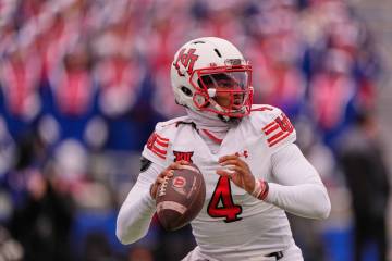 Utah quarterback Devon Dampier looks to pass during the first half of an NCAA college football ...