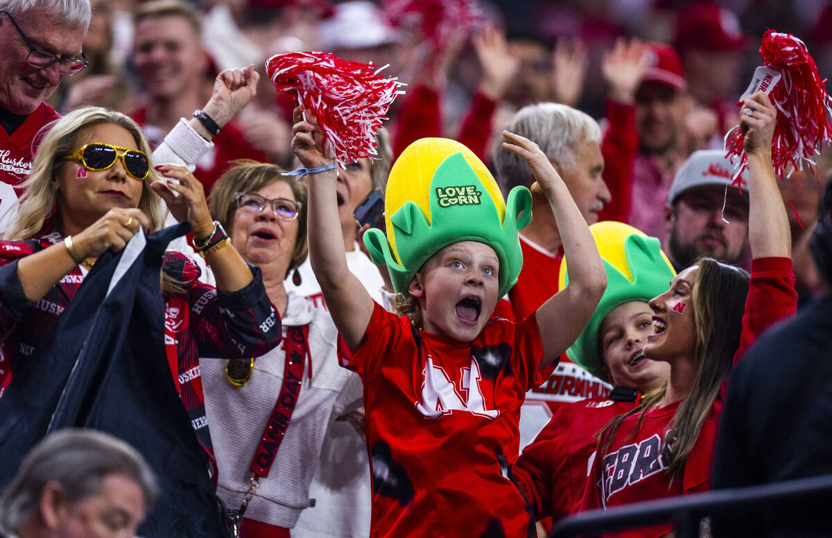 Nebraska Cornhuskers fans celebrate a score against the Utah Utes during the first half of thei ...