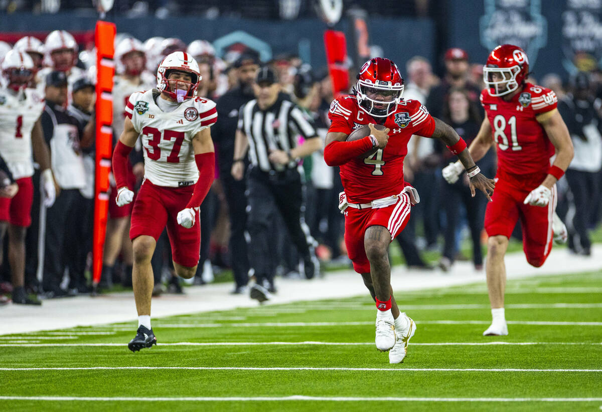 Utah Utes quarterback Devon Dampier (4) sprints down the field on a large yardage gain as Nebra ...