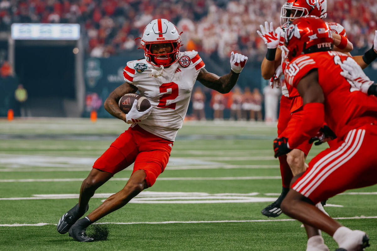 Nebraska Cornhuskers wide receiver Jacory Barney Jr. (2) pivots around Utah defenders on his wa ...
