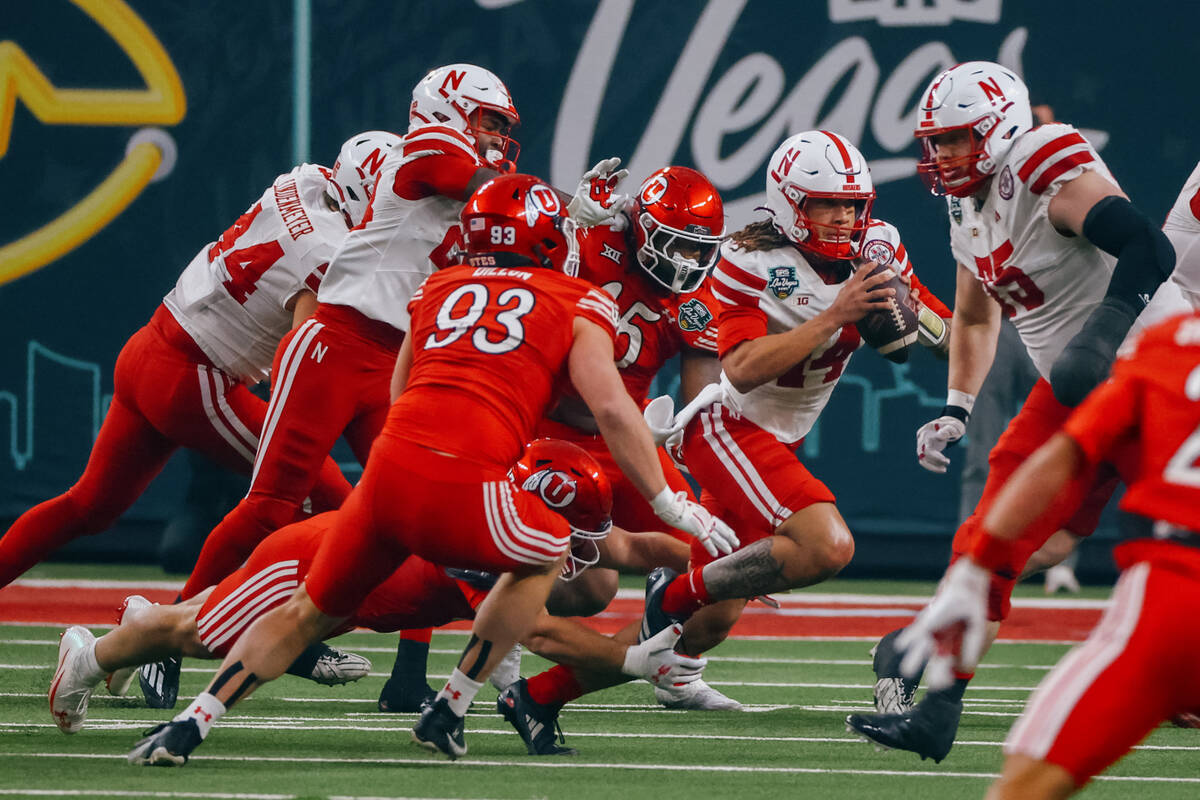 Nebraska Cornhuskers quarterback TJ Lateef (14) runs with the ball during the first half of the ...