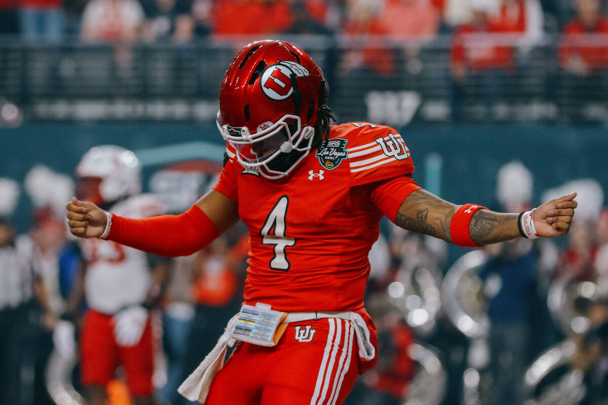 Utah Utes quarterback Devon Dampier (4) celebrates running in a touchdown during the first half ...