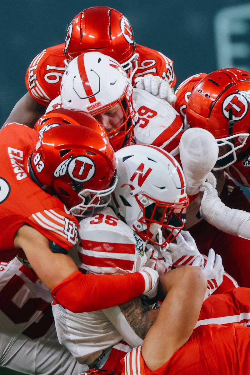 Players surround ballcarrier Nebraska Cornhuskers running back Mekhi Nelson (35) during the sec ...