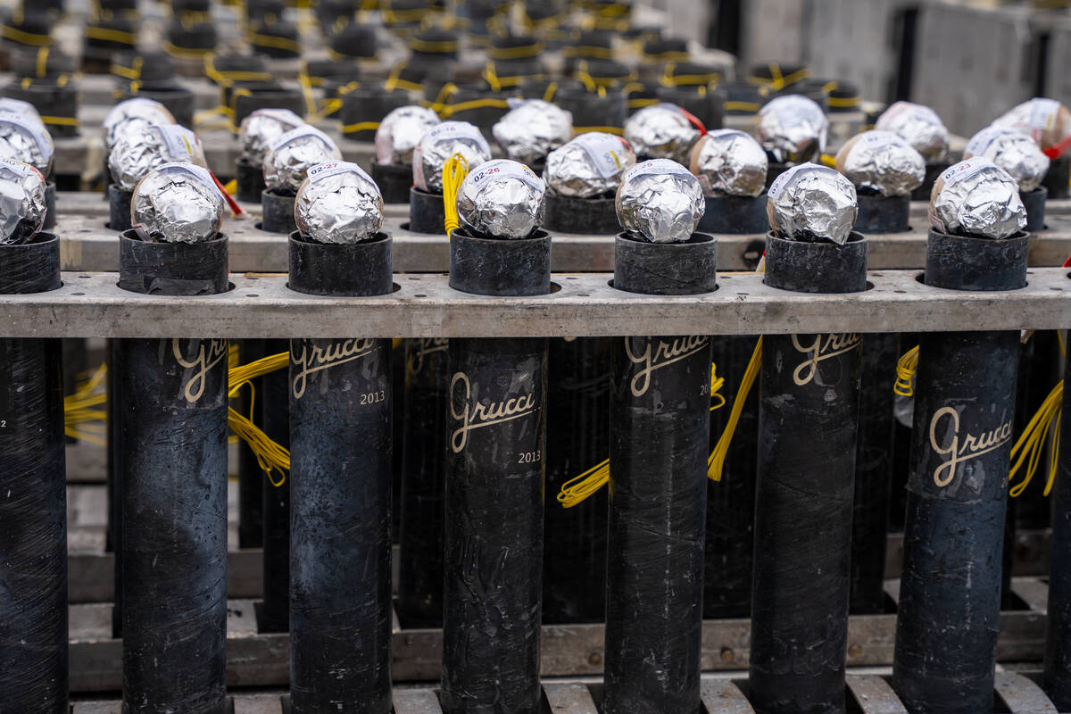 Fireworks wait to be wired on the roof of Treasure Island Las Vegas ahead of New Year’s ...